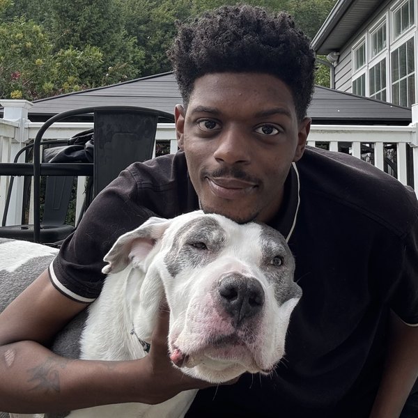 Leon, owner of Scoopem, with his dog